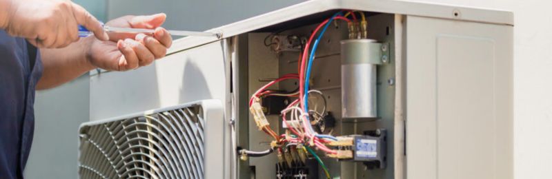 Furnace technician repairing a heating system in Bonsall CA